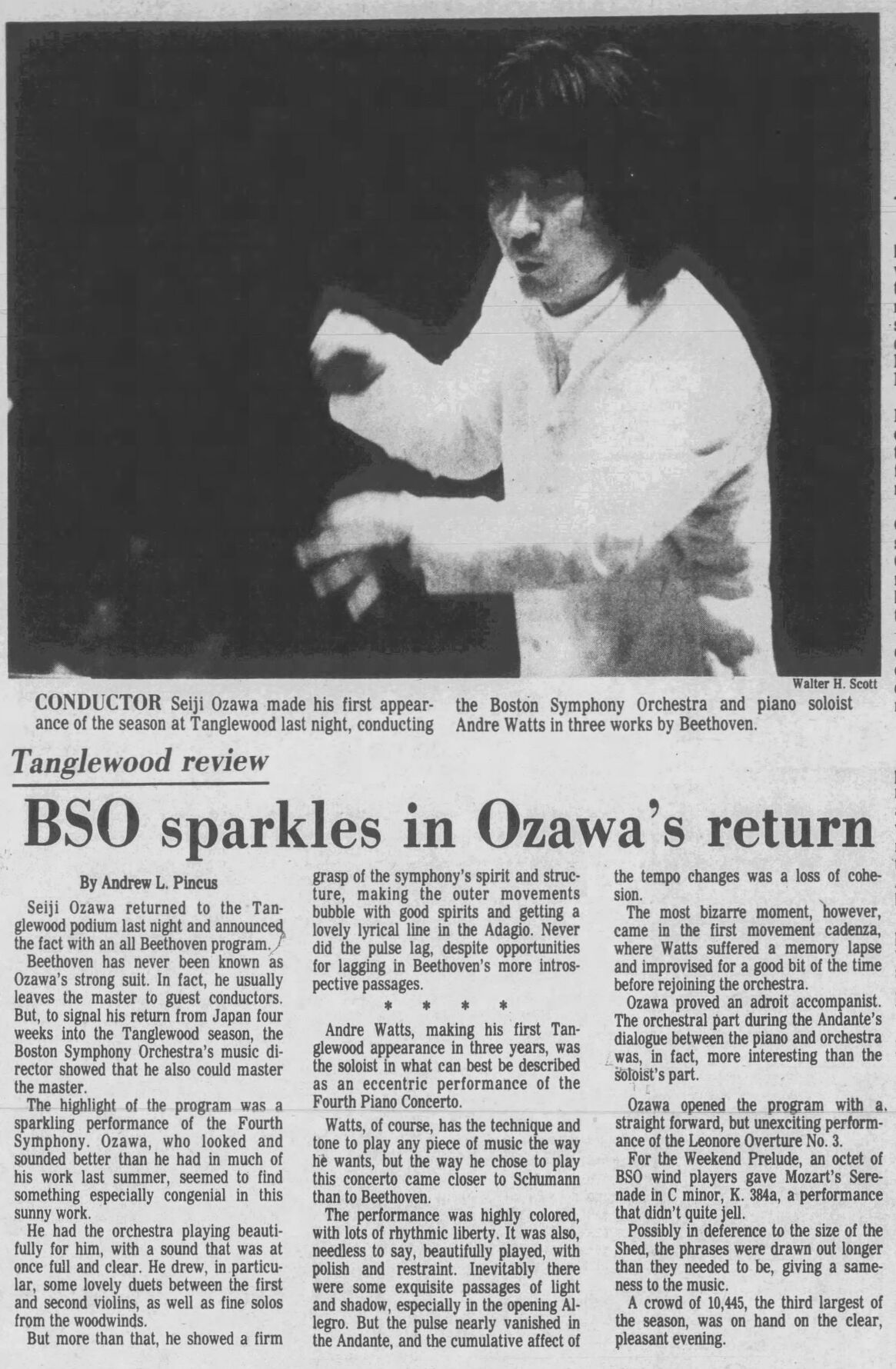 black and white newspaper page with photo of many conducting